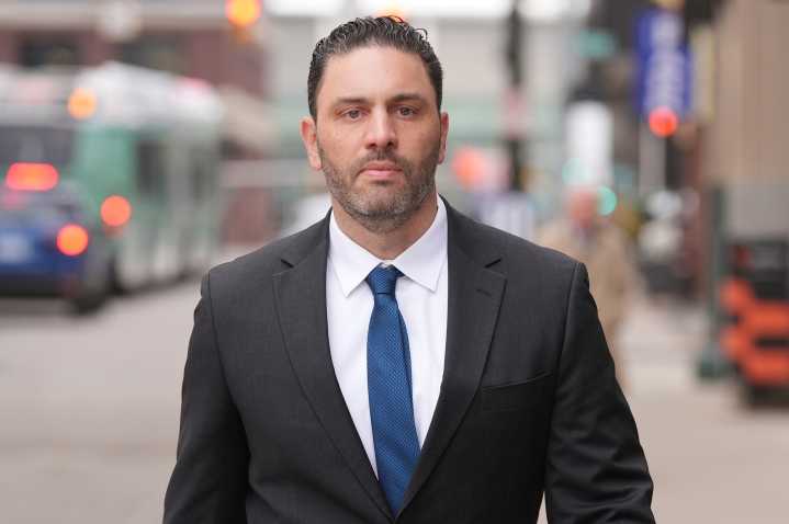 Ex-Michigan football coach asks judge to dismiss part of hacked images case
