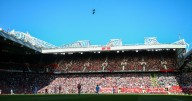 Why do Manchester United play 'Take Me Home, Country Roads' before home games?