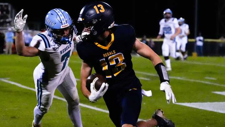 See our best photos from Iowa City Regina vs. Northeast football game