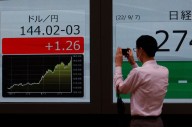Japan may intervene if yen dives toward 160 per dollar, ex