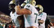 No. 24 South Florida scores 4 TDs in a 4 1/2-minute span and hands North Texas its 1st loss