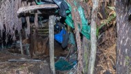 Photos reveal the secret bush camps fugitive father used to hide his children