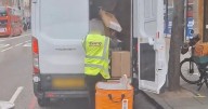 Shocking moment courier seen on camera launching parcels into back of van