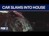Four injured after car slams into home