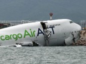 Two killed as cargo jet crashes off runway into sea at Hong Kong airport