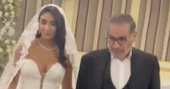 Ayatollah’s Enforcer Sparks Outrage With Daughter’s Plunging Wedding Dress