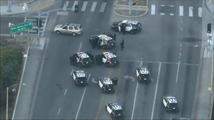 Driver arrested after standoff on 10 Freeway overpass near West Adams