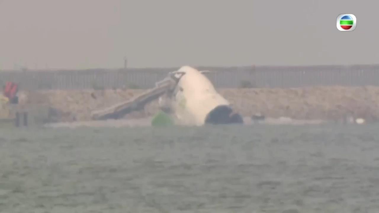 Cargo plane skids off Hong Kong runway into sea during landing, killing 2 people