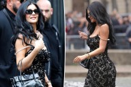 Kylie Jenner exposes bra strap with sheer lace Miu Miu dress during Paris Fashion Week