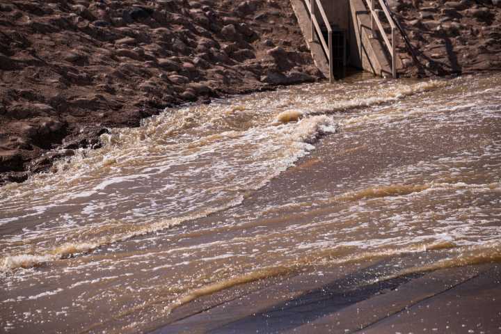 Vehicle swept away in Weekes Wash, driver rescued by police