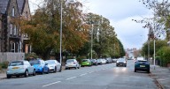 Woman drives off after stranger jumps into her car and stabs man in back seat