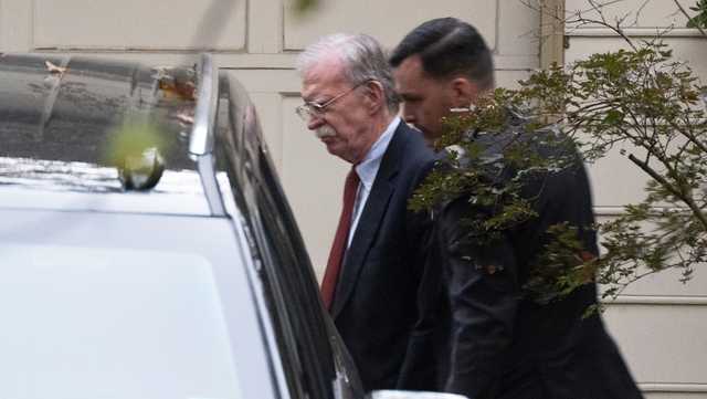 Bolton arrives at court to surrender to authorities on charges in classified information case