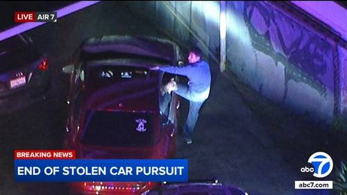 Orange County chase ends after authorities surround driver, passenger in suspected stolen car