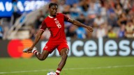 Canadian defender Moise Bombito stretchered off with leg injury