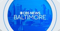 Baltimore police officer hospitalized after being struck by a car