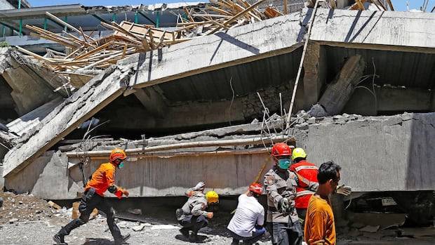 'Racing against time': Indonesian rescue workers search for dozens in rubble of collapsed school