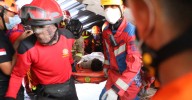 Frantic rescue rush as survivors found beneath rubble of collapsed Indonesian school