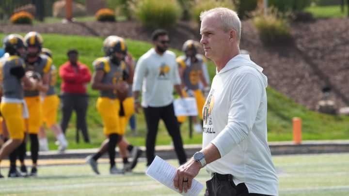Photos of Monroe County Region players on Adrian College football team