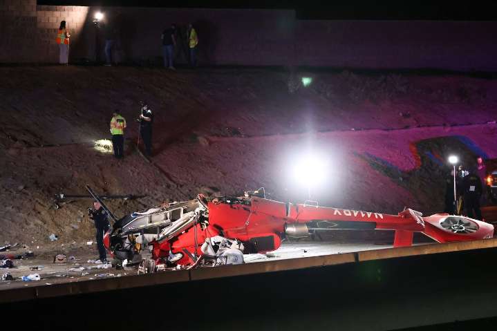 Motorists help to rescue woman trapped under crashed helicopter on California highway