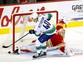 Canucks 8, Flames 1: Elias Pettersson's blast from past overshadows roster battles
