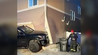 Photos: Car crashes into Denver residence