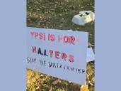 Masked data center protestors litter Ypsilanti utility officials’ yards with computer parts