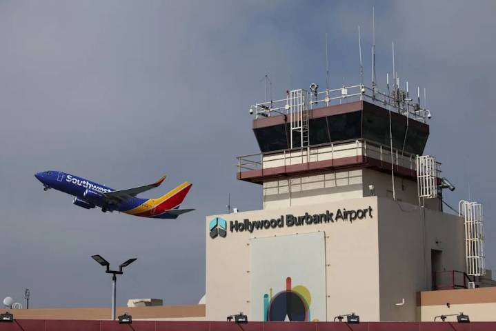 A plane takes off from Hollywood Burbank Airport as operations resume a day after the airport operated for hours without a staffed control tower due to staffing shortages amid the U.S. government shut