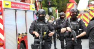 Two members of the public dead in synagogue attack as hospitals 'in lockdown'