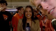 WATCH: Reporter Somehow Keeps it Together as College Kids Crash Her Live Shot