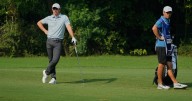 Shane Lowry leads in India with a 64, Rory McIlroy leaves driver out of the bag and shoots 69