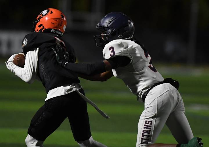 Photos of Bloomfield Hills Brother Rice vs. Sterling Heights Stevenson in football action at Lawrence Tech University