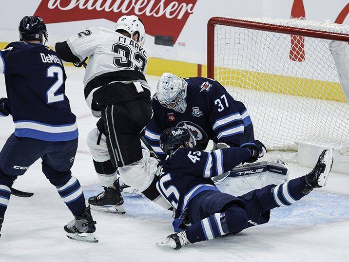 Jets withstand a fight from the Los Angeles Kings in NHL action