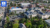 Friends' School staff member charged with child abuse offence after Hobart raids