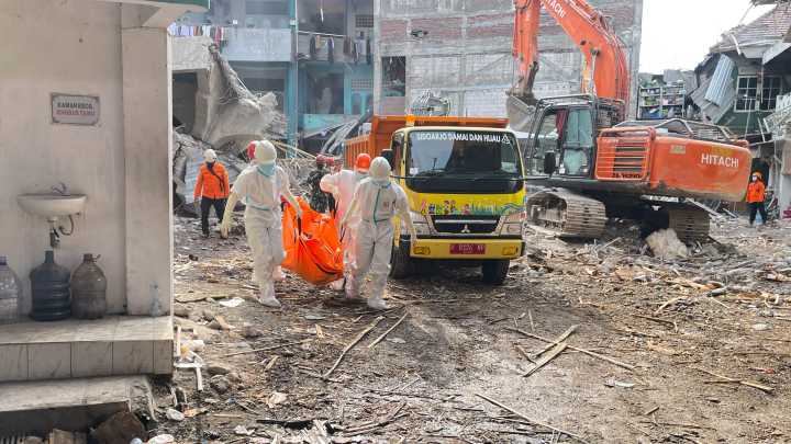Indonesian rescuers search for missing students after school collapse kills 49