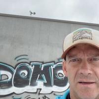 Local businessman hits the rooftops to record graffiti painted on his building
