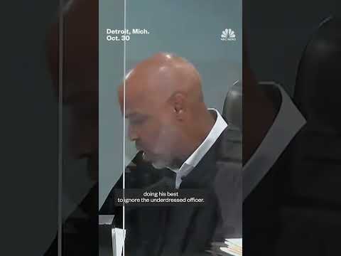 Police officer appears to be without pants in virtual court