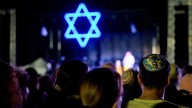 Vigils mark Israel attack anniversary, Gaza death toll