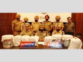 Pak-backed smuggling racket busted, 2 held with 5 kg heroin, Rs.29 lakh drug money [ FULL VIEW ]