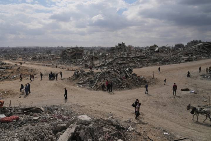 The Latest: Palestinians journey back home as aid convoys start to enter Gaza