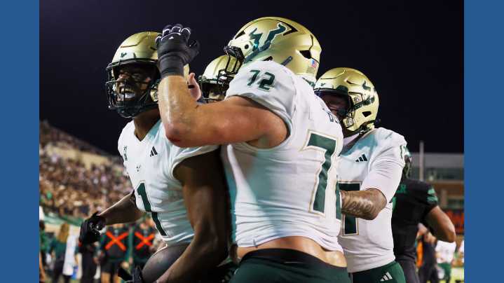 No. 24 South Florida scores 4 TDs in a 3 1/2-minute span and hands North Texas its 1st loss
