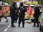 Police say one victim possibly shot by officer during Manchester attack