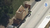 Big rig hits overpass on 110 Fwy; SigAlert in effect
