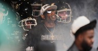 Colorado fans storm field after win over No. 22 Iowa State, Deion Sanders loves it but fine may loom