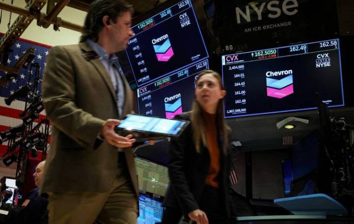 Dow, S&P 500 manage record closing highs; Nasdaq falls