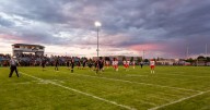Post Falls football players under fire for promotional photo depicting mock execution of rival Coeur d’Alene player