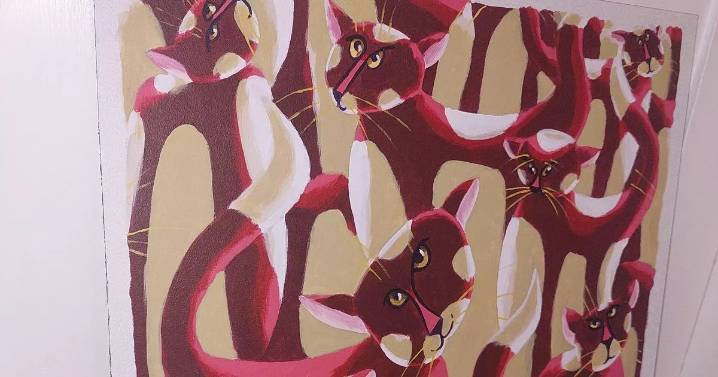 Charity shopper spends £20 on cat painting then realises its true value