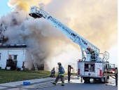Trenton fire displaces nine people, kills two dogs, razes home