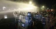 Georgia's police use water cannons to push back protesters trying to storm presidential palace