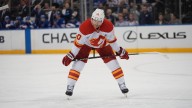 Flames’ Jonathan Huberdeau exits after colliding with Canucks’ Kevin Lankinen