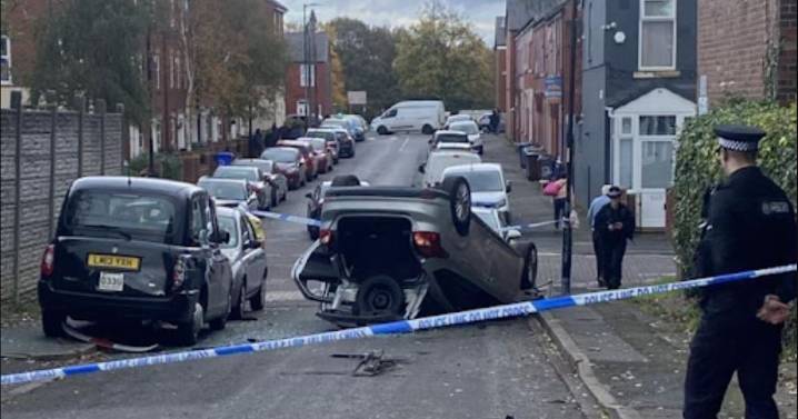 Car pictured on its roof as man stabbed to death after crash in Cheetham Hill murder probe